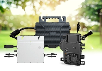 Image of several microinverters for solar panels from Astro, Enphase and Hoymiles, with visible connectors, set against a blurred background of greenery.